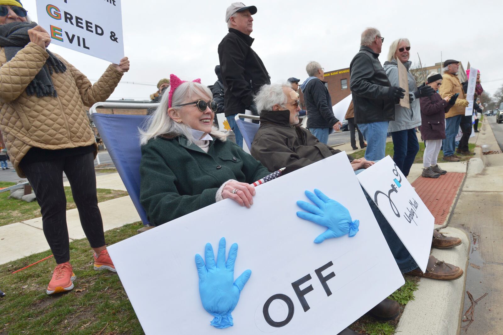 Hundreds of people gather in downtown St. Joseph, Mich., Saturday, April 5, 2025, during a "Hands Off" rally held to protest the Trump administration and recent DOGE cuts. (Don Campbell/The Herald-Palladium via AP)