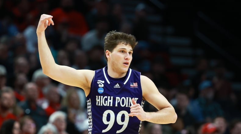 High Point guard Chase Johnston reacts after shooting a 3-pointer during the first half in the first round of the NCAA college basketball tournament against Wisconsin, Thursday, March 19, 2026, in Portland, Ore. (AP Photo/Craig Mitchelldyer)