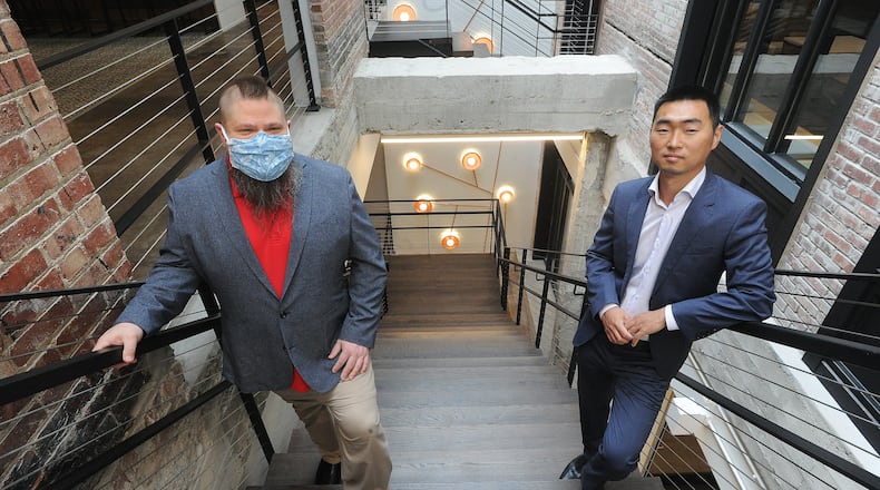 Luis Estevez, left and Yuxing Wang, inside The Hub powered by PNC in the Arcade. MARSHALL GORBY\STAFF