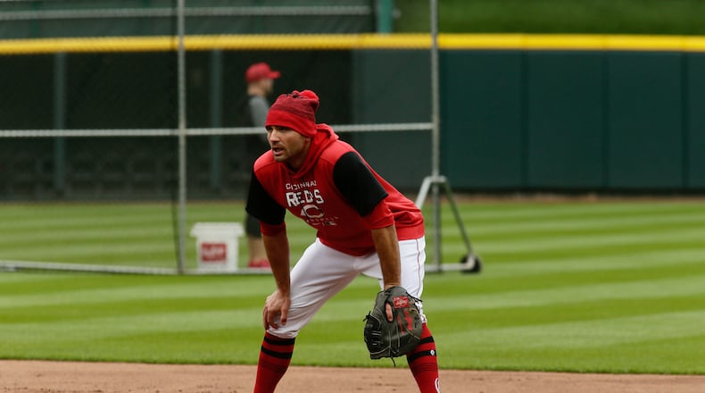 Reds first baseman Joey Votto takes infield on Opening Day on April 12, 2022, at Great American Ball Park in Cincinnati. David Jablonski/Staff