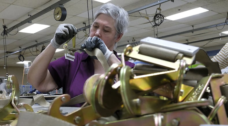 Sandy Reynolds, an employee of TAC Industries, works on a cargo net at the company’s Selma Road location. TAC’s contract with the U.S. Air Force was renewed this week.. Bill Lackey/Staff