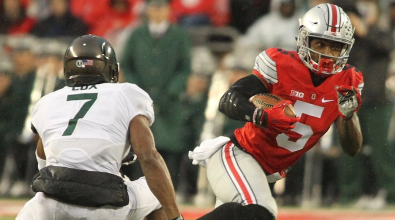 Ohio State’s Braxton Miller carries the ball on Saturday, Nov. 21, 2015, at Ohio Stadium in Columbus. David Jablonski/Staff