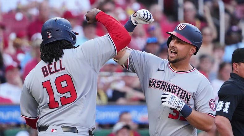 Washington Nationals' Nathaniel Lowe, right, is congratulated by teammate Josh Bell (19) after hitting a three-run home run during the first inning of a baseball game against the St. Louis Cardinals Wednesday, July 9, 2025, in St. Louis. (AP Photo/Jeff Roberson)