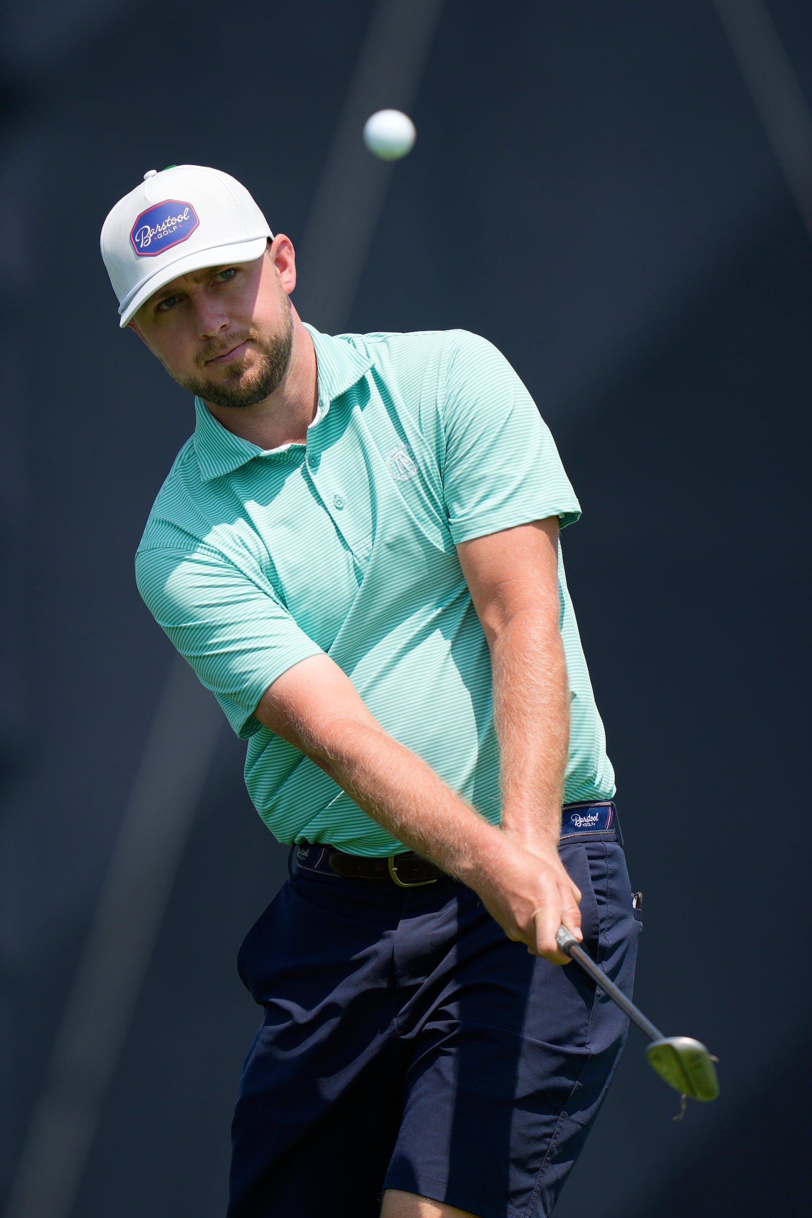 Alistair Docherty chips on the third hole during a practice round ahead of the U.S. Open golf tournament at Oakmont Country Club Wednesday, June 11, 2025, in Oakmont, Pa. (AP Photo/Charlie Riedel)