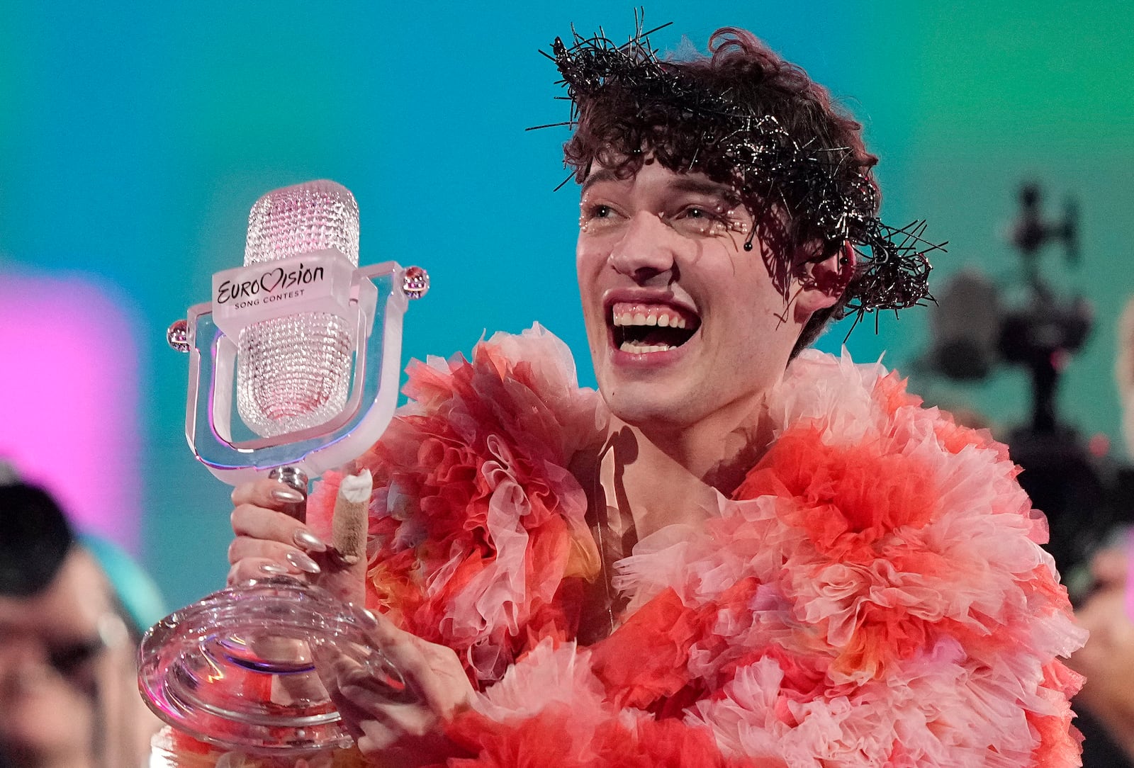 FILE - Nemo of Switzerland, who performed the song The Code, celebrates after winning the Grand Final of the Eurovision Song Contest in Malmo, Sweden, on May 12, 2024. (AP Photo/Martin Meissner, File)