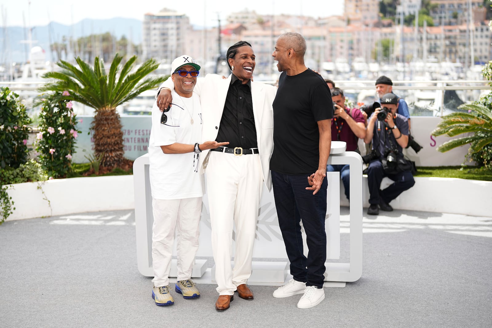 Director Spike Lee, from left, A$AP Rocky and Denzel Washington pose for photographers at the photo call for the film 'Highest 2 Lowest' at the 78th international film festival, Cannes, southern France, Monday, May 19, 2025. (Photo by Scott A Garfitt/Invision/AP)
