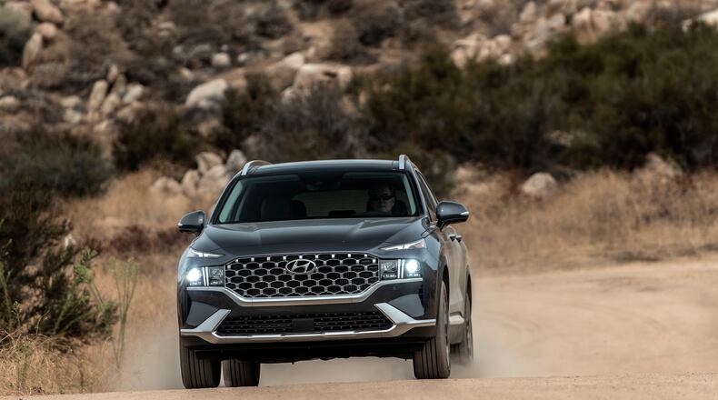 This photo provided by Hyundai shows the 2021 Santa Fe with new styling, upgraded available engines and a lot of equipment at an attractive price. (Drew Phillips/Courtesy of Hyundai Motor America via AP)
