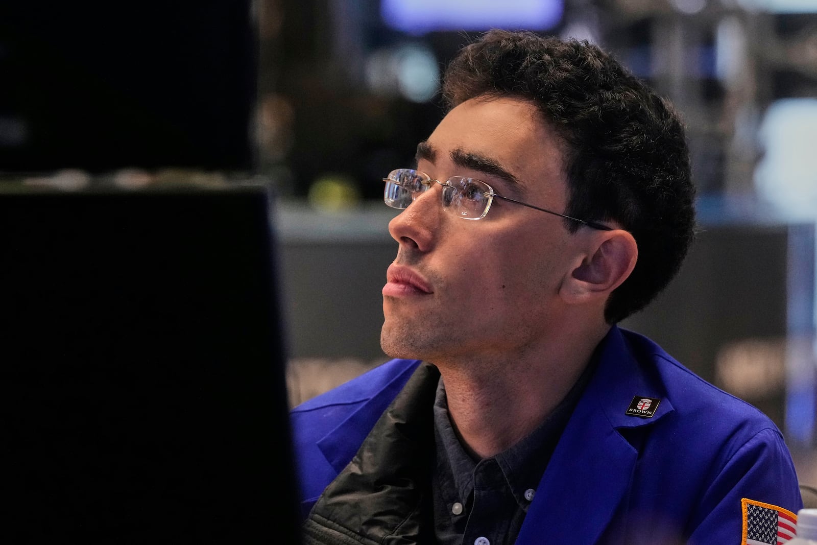 Specialist Alex Weitzman works at his post on the floor of the New York Stock Exchange, Monday, July 21, 2025. (AP Photo/Richard Drew)