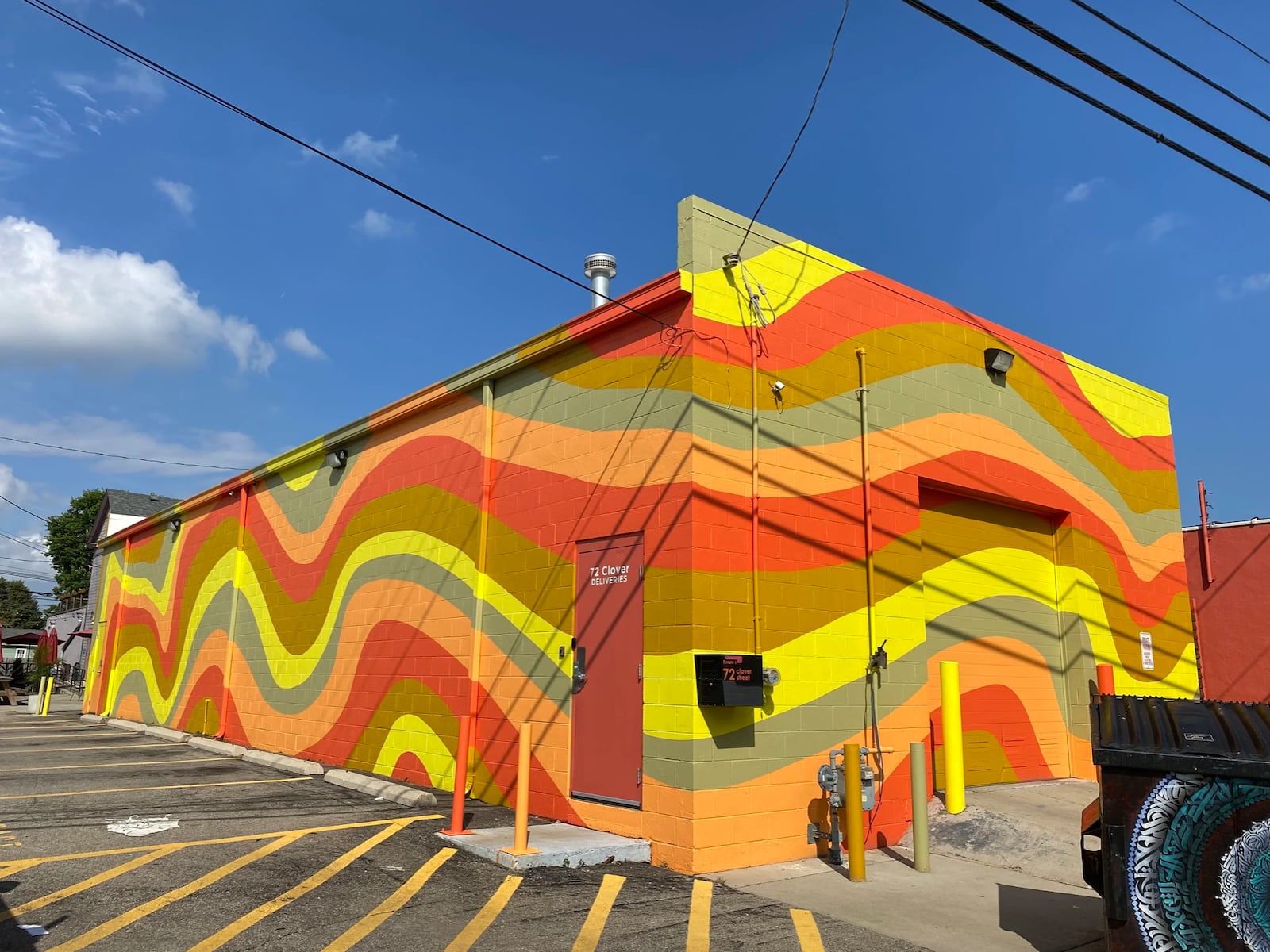 Atalie Gagnet painted the mural outside Ghostlight Coffee in Dayton. “I like a crispy edge. I want it to look like somebody put a sticker up there. I pay a lot of attention to color relationships. I want the colors to pop," she said. CONTRIBUTED PHOTO