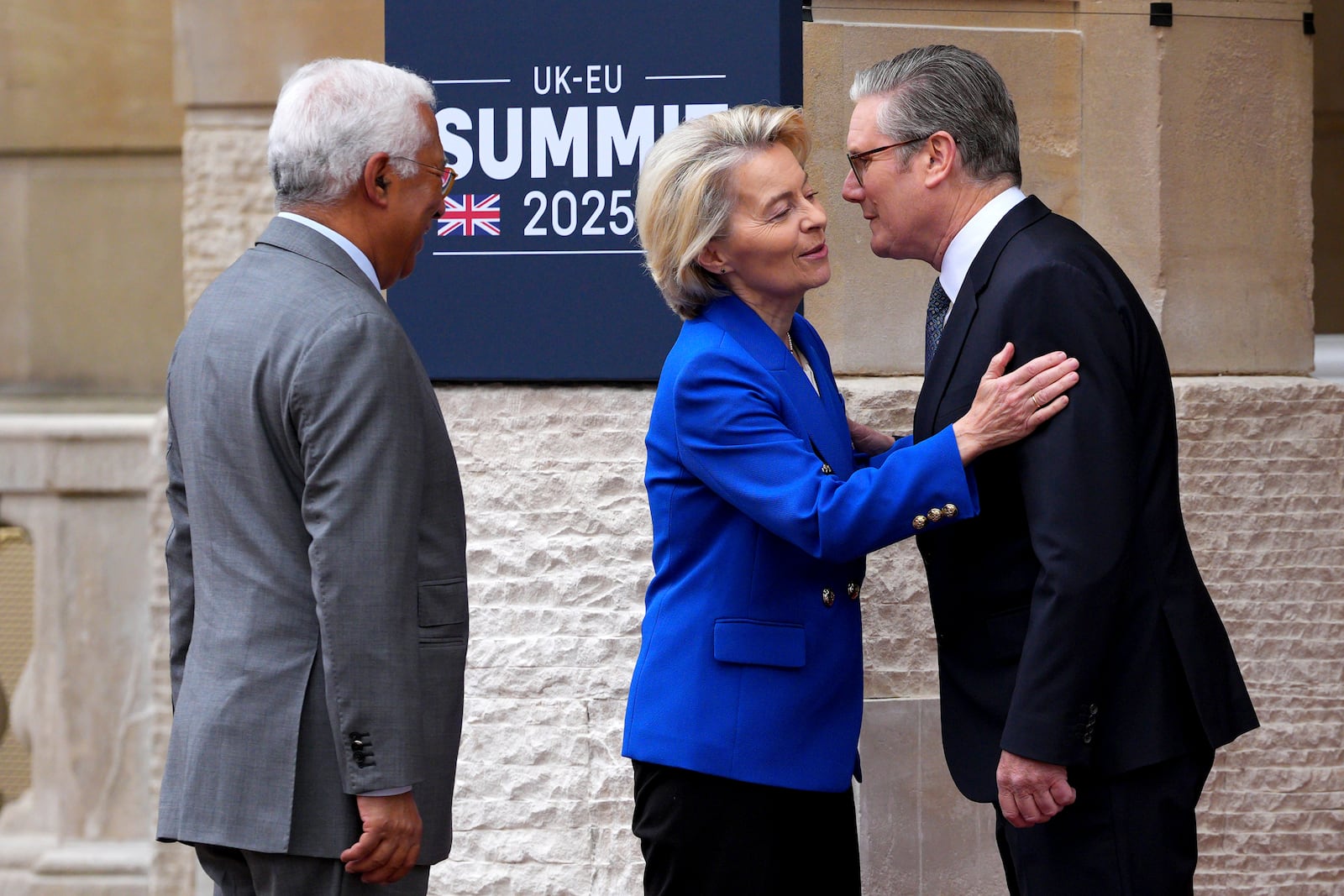 Britain's Prime Minister Keir Starmer, right, greets European Commission President Ursula von der Leyen as she arrives with European Council President Antonio Costa to attend a United Kingdom and European Union summit at Lancaster House, London, Monday, May 19, 2025. (Carl Court/Pool Photo via AP)