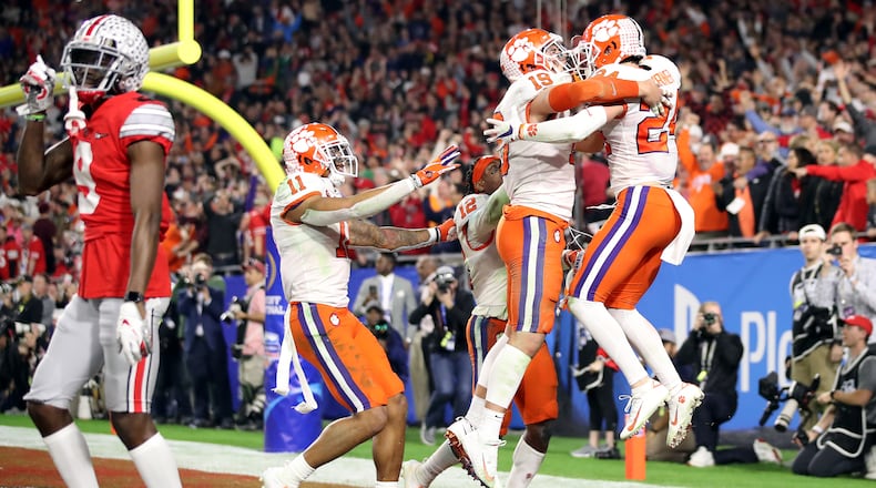 GLENDALE, ARIZONA - DECEMBER 28: Nolan Turner #24 of the Clemson Tigers is congratulated by his teammates after intercepting the ball in the final minute of the second half against the Ohio State Buckeyes during the College Football Playoff Semifinal at the PlayStation Fiesta Bowl at State Farm Stadium on December 28, 2019 in Glendale, Arizona. (Photo by Christian Petersen/Getty Images)