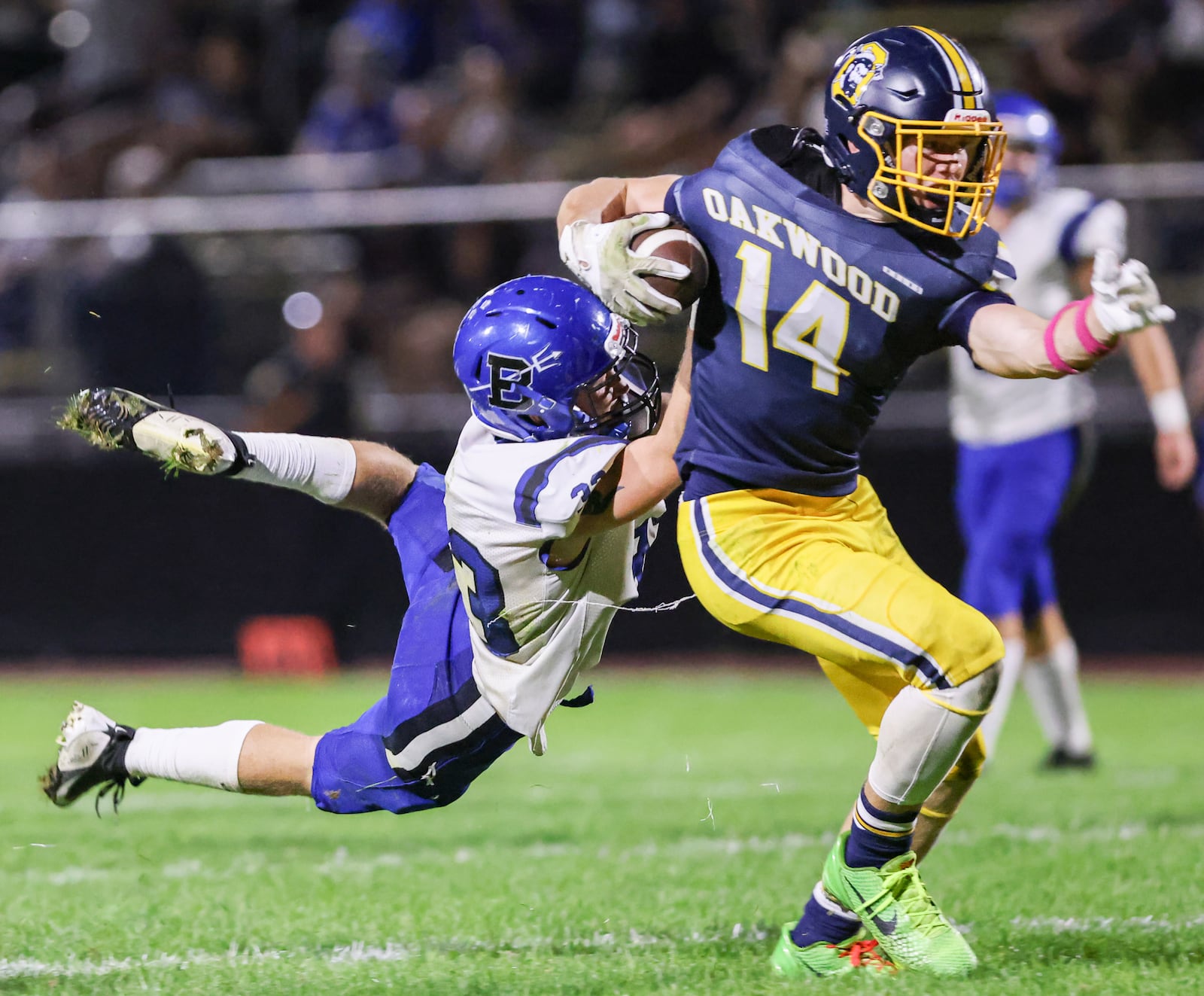 Oakwood junior receiver Michael Woeste fights for extra yardage as Brookville's Hunter Gisewite tries to bring him down during a Southwestern Buckeye League game on Friday, Oct. 3  at Mack Hummon Stadium. BRYANT BILLING / STAFF