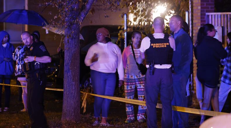 Police investigate after three people were shot Tuesday night, Oct. 25, 2022 in the 700 block of Second Street in Hamilton. Two of those shot have died and a child was also hit by bullet fragments. NICK GRAHAM/STAFF