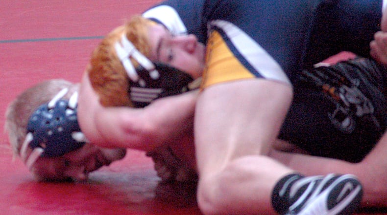 Springfield’s Jacob Yost works on securing the fall to move into the quarters at 170 at the GMVWA Holiday Tournament at Vandalia’s SAC Wednesday night. JOHN CUMMINGS / CONTRIBUTED