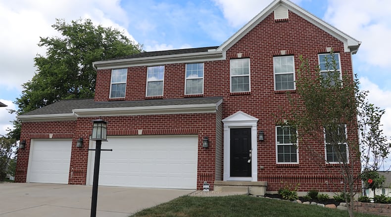 The 4-bedroom 2-story house sits on a full, unfinished basement and has a 3-car garage. CONTRIBUTED PHOTO BY KATHY TYLER