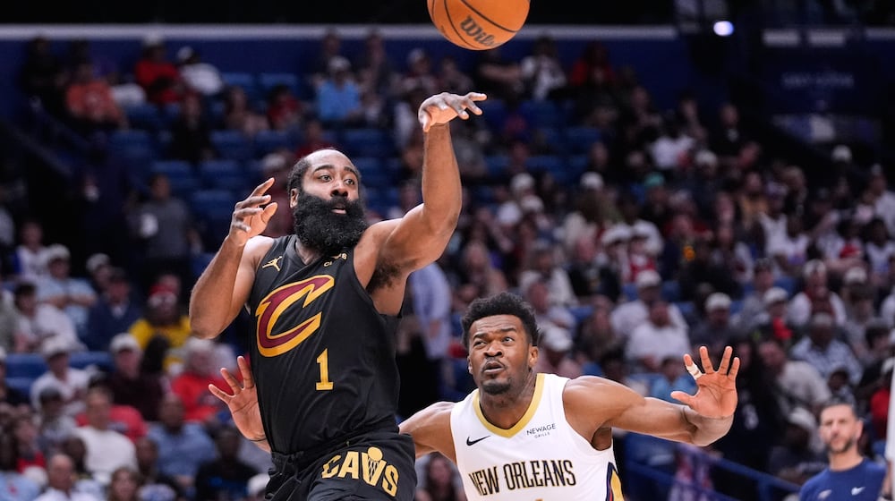 Cleveland Cavaliers guard James Harden (1) passes around New Orleans Pelicans center Yves Missi in the first half of an NBA basketball game, Saturday, March 21, 2026, in New Orleans. (AP Photo/Gerald Herbert)