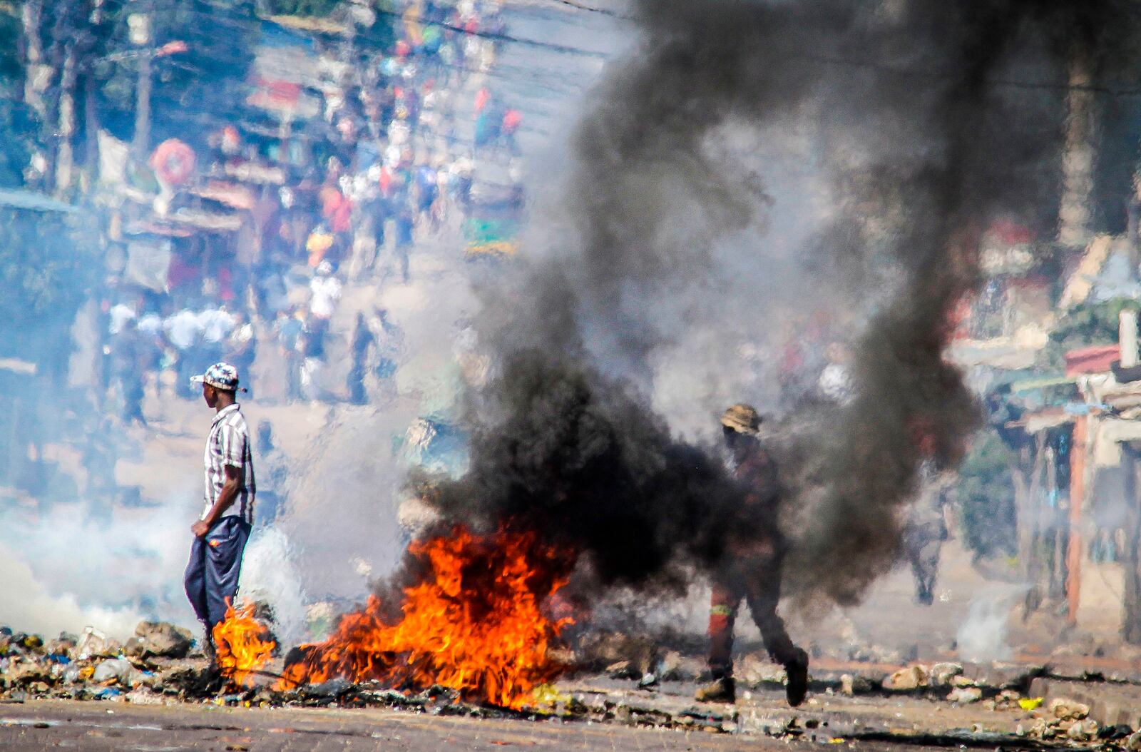 FILE- A barricade burns in Mozambique's capital, Maputo, Tuesday, Nov. 5, 2024. (AP Photo/Carlos Uqueio, file)