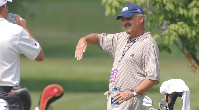 CBS TV commentator Gary McCord talks golf on the driving range before the third round of The Memorial at Muirfield Village Golf Club in Dublin, Ohio on June 4, 2005. (Photo by Al Messerschmidt/Getty Images)