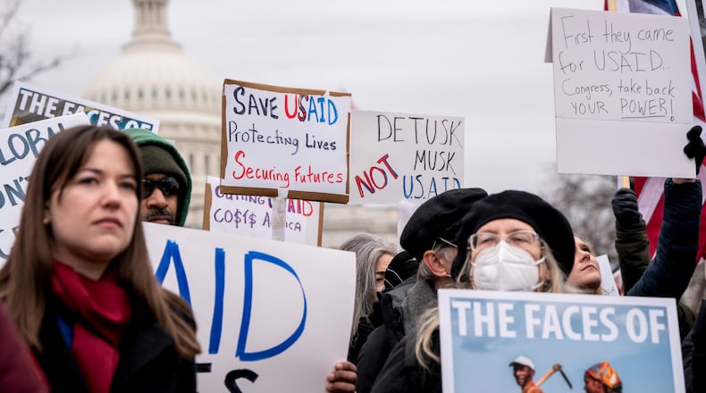 FILE — Employees and supporters attend a rally in support of the U.S. Agency for International Development near the Capitol in Washington, Feb. 5, 2025. The Trump administration is systematically exploiting loopholes to effectively keep much of the president’s blanket spending freezes in place, accounts by officials and court filings show, despite restraining orders from judges who have told agencies to disregard the directives. (Haiyun Jiang/The New York Times)