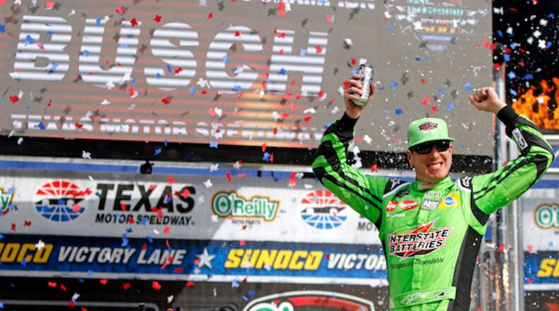 Kyle Busch (18) celebrates his win of the O'Reilly Auto Parts 500 at Texas Motor Speedway Sunday April 8, 2018 in Fort Worth, Texas. (Bob Booth/Fort Worth Star-Telegram/TNS)