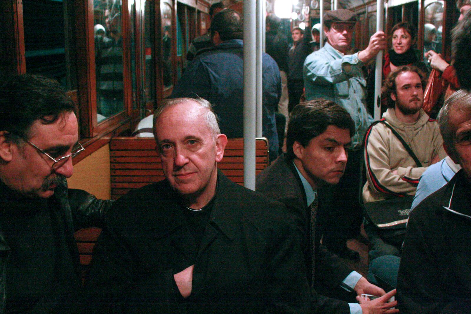 FILE - Cardinal Jorge Mario Bergoglio, second from left, travels on the subway in Buenos Aires, Argentina, in 2008. (AP Photo/Pablo Leguizamon, File)
