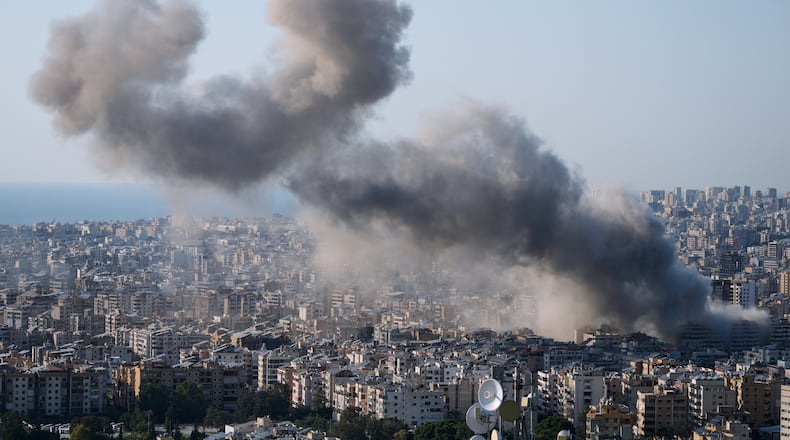Smoke rise from an Israeli airstrike in Dahiyeh, Beirut's southern suburbs, Lebanon, Tuesday, March 10, 2026. (AP Photo/Bilal Hussein)