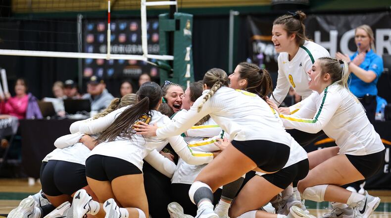 The Wright State volleyball team celebrates after beatin Northern Kentucky in the Horizon League championship match Sunday at McLin Gymnasium. Austyn McFadden/Wright State Athletics photo