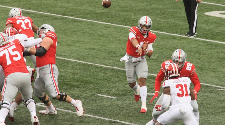 Ohio State's Justin Fields throws a pass against Indiana on Saturday, Nov. 22, 2020, at Ohio Stadium in Columbus. David Jablonski/Staff