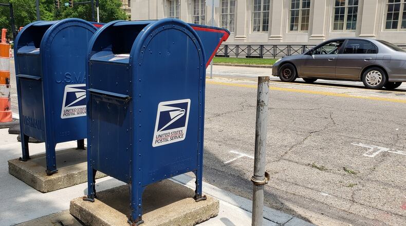 The popular drive by mail boxes on Front Street in Hamilton have been moved for a paving and sidewalk project. The move is only temporary, according to officials. NICK GRAHAM/STAFF