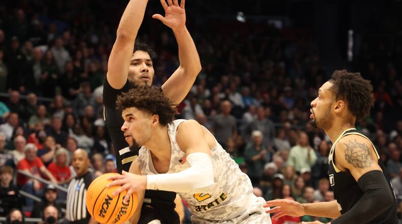 Wright State’s Tanner Holden tries to work inside against Bryant Wednesday, March 16, 2022 during the First Four tournament at UD Arena.