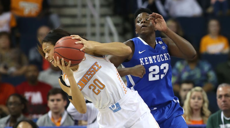 Tennessee center Isabelle Harrison (20) grabs a rebound against Kentucky forward/center Samarie Walker (23) in the second half of the finals of the Women's Southeastern Conference NCAA college basketball game, Sunday, March 9, 2014, in Duluth, Ga. Tennessee defeated Kentucky 71-70. (AP Photo/Jason Getz)