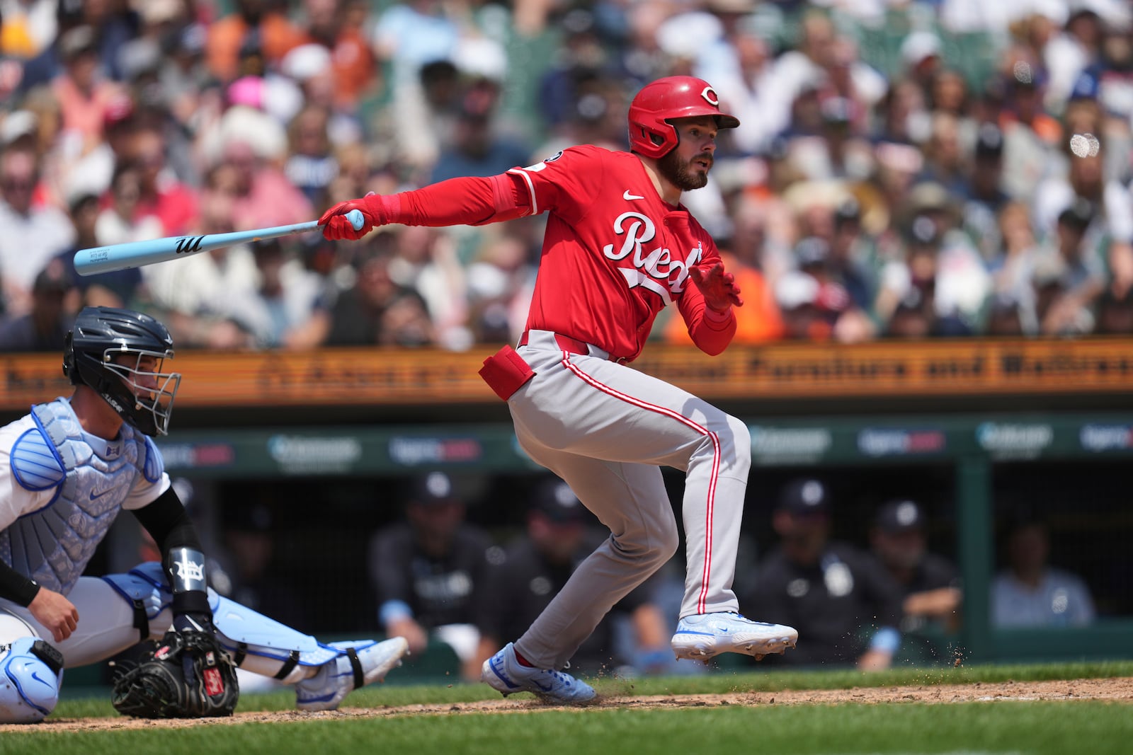 Cincinnati Reds' Gavin Lux hits a one-run single against the Detroit Tigers in the eighth inning during a baseball game, Sunday, June 15, 2025, in Detroit. (AP Photo/Paul Sancya)