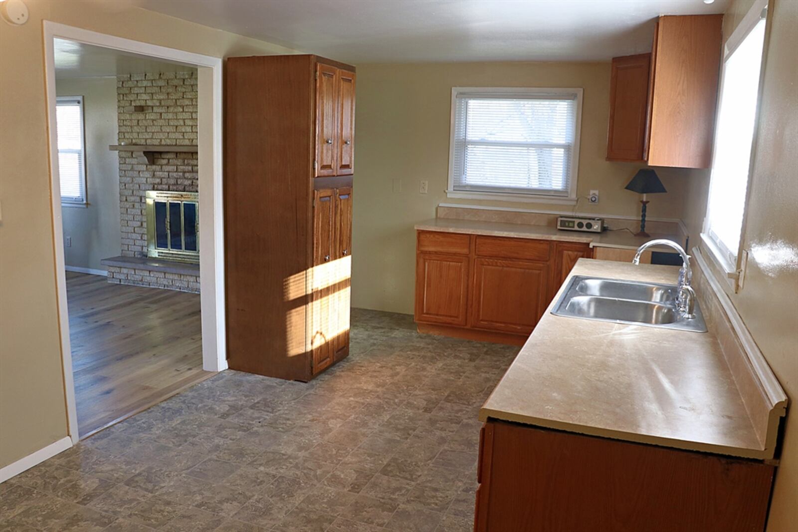 An open threshold leads into the eat-in kitchen. Two banks of cabinetry and counters offer plenty of preparation space. CONTRIBUTED BY KATHY TYLER