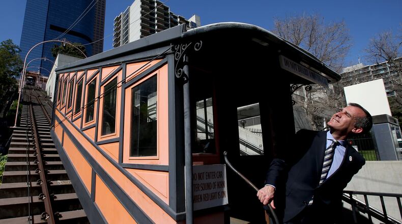 Los Angeles Mayor Eric Garcetti poses for pictures after joining city officials, contractors and dignitaries for a press conference Wednesday, March 1, 2017, announcing the refurbishment and reopening of the historic Angels Flight railway in downtown L.A. (Luis Sinco/Los Angeles Times/TNS)