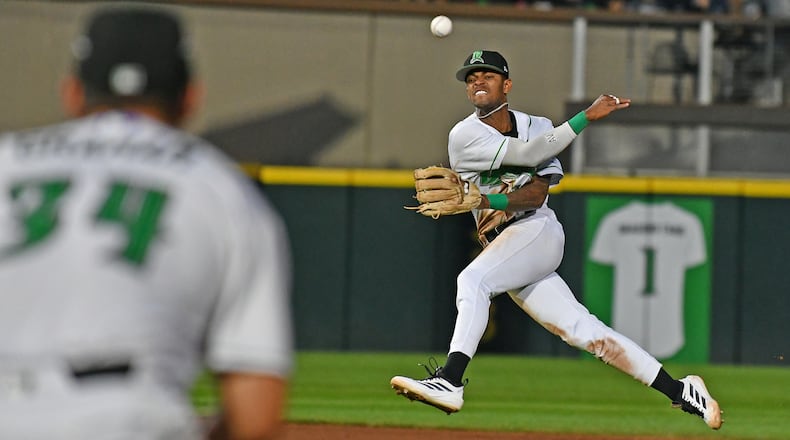 Shortstop Alexander Vargas fires a throw to first baseman Carter Graham on a throw that was late after the ball hit off the pitcher Wednesday night at Day Air Ballpark. JEFF GILBERT/CONTRIBUTED
