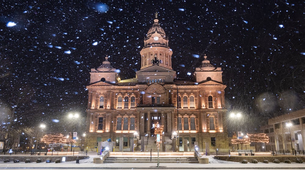 Snow is seen in downtown Troy near the Miami County Courthouse on Saturday, Jan. 24, 2026. By 10 a.m. Sunday, the Miami Valley region was experiencing around 12 inches of snow in some areas. Visit DaytonDailyNews.com for the latest snow coverage. BRYANT BILLING/STAFF
