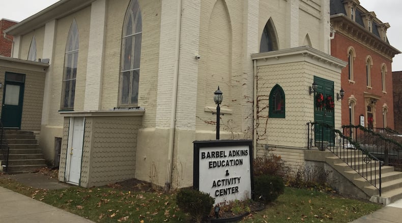 The former Trinity Episcopal Church on East Franklin Street in Troy — here shown as the Adkins Center — was being considered for demolition to may be demolished to accommodate expansion of the The Family Abuse Shelter of Miami County’s Franklin House shelter next door. NANCY BOWMAN / STAFF