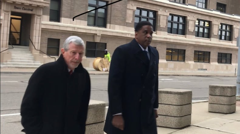 Former Dayton City Commissioner Joey Williams (right) outside the federal building in Dayton Wednesday. Photo by Jim Otte.