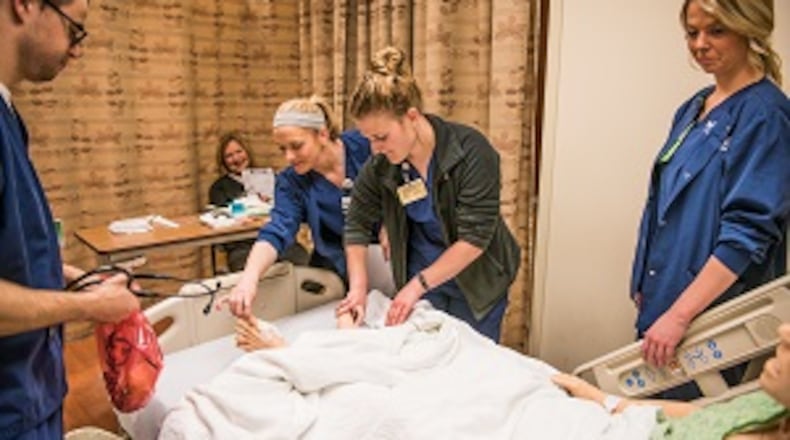 Nursing students work in a nursing lab at Kettering College earlier this year. From left, Ian Valentine, Kari Cox, Alyssa Adams, Danielle Engle and instructor Kathleen Volt. CONTRIBUTED