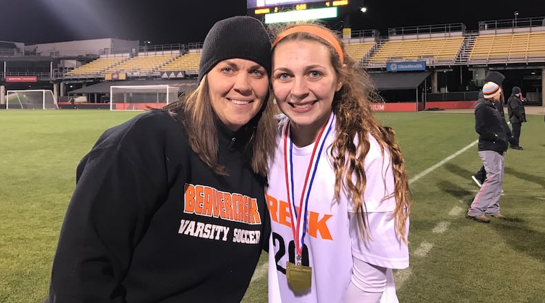 Beavercreek’s Sarah and Tiernan McKitrick pose for a photo after winning the state championship on Nov. 9, 2018, at MAPFRE Stadium in Columbus.
