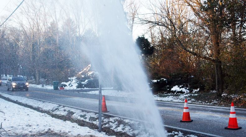 Water went shooting 20 to 30 feet into the air after a main break in Washington Twp. in this file photo. Montgomery County is planning a 14 percent increase in water and sewer rates to generate revenue to make repairs to its aging water infrastructure. Tim Chesnut / Staff