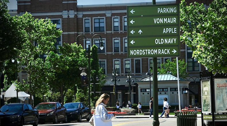 Signage points shoppers to some of the 100-plus stores and restaurants at The Greene Town Center in Beavercreek on Tuesday, May 16, 2024. MARSHALL GORBY / STAFF