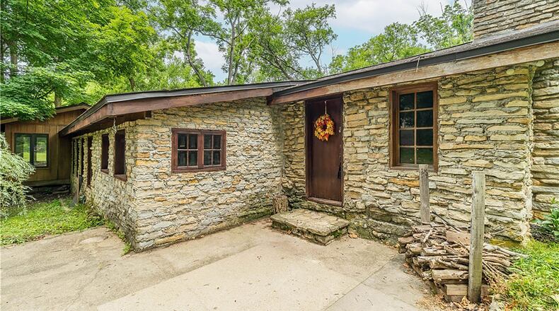 This one bedroom rustic stone cabin needs updates but retains much of its original charm. It sits on 53 diverse acres of farmland, fields and woods.