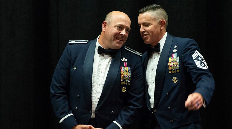 Col. Patrick Miller (left), 88th Air Base Wing and installation commander, chats with Chief Master Sgt. Jason Shaffer, 88 ABW command chief, prior to the start of the Chief Master Sgt. Induction Medallion Ceremony inside the National Museum of the U.S. Air Force on July 10. After a two-year leadership stint, Miller and Shaffer are set to move on to new assignments. U.S. AIR FORCE PHOTO/WESLEY FARNSWORTH