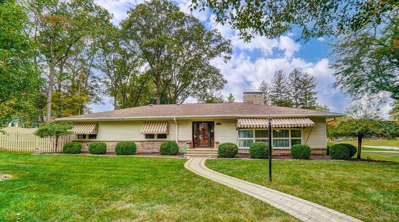 The front of the home features a brick paver walk that connects the front entry to the street. There is a side-entry, two-car attached garage. Contributed photos