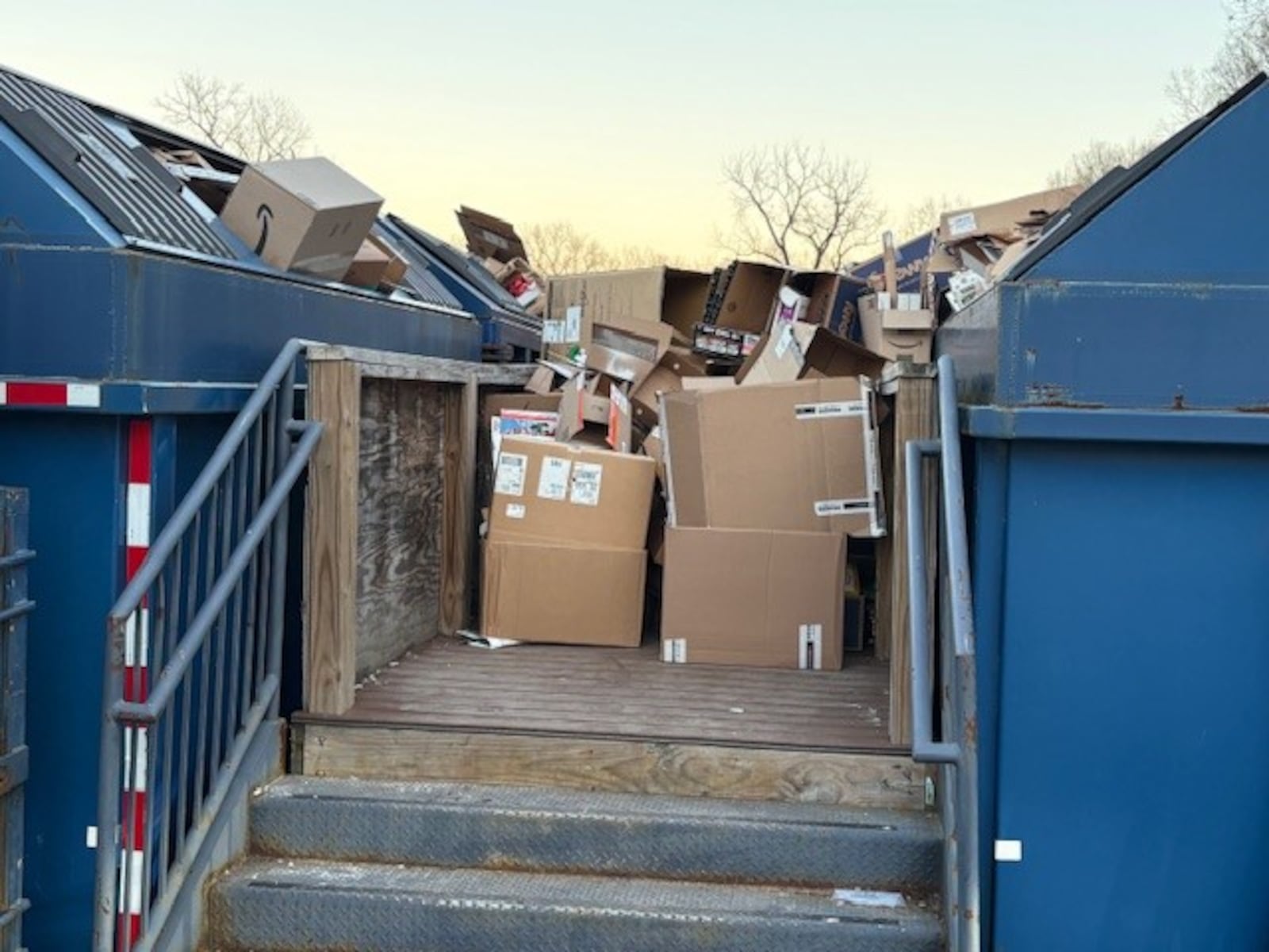 Cardboard boxes are overflowing from collection containers Sunday, Dec. 21, 2025, at the public works recycling center, 210 Shafor Blvd. in Oakwood. JEN BALDUF/STAFF