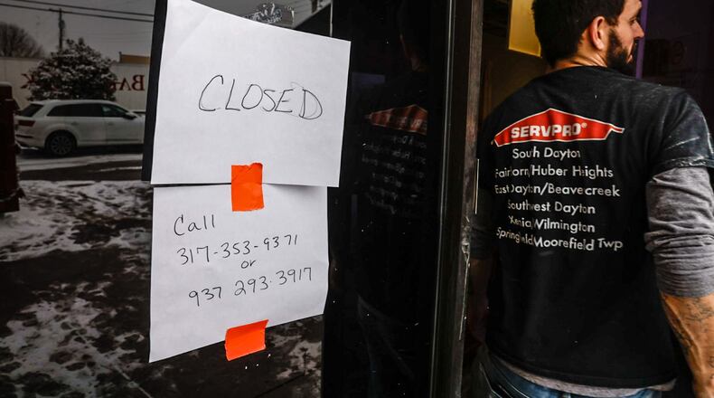 A Servpro employee enters the Women's Med Center in Kettering following water damage from frozen pipes Friday January 19, 2024. JIM NOELKER/STAFF