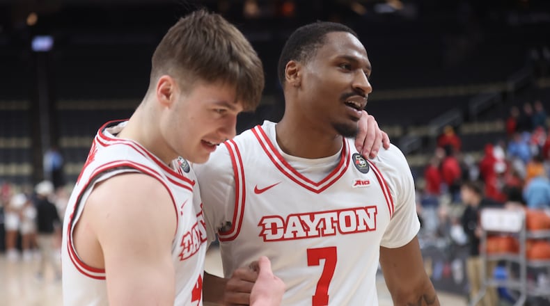 Dayton's Jordan Derkack, left, and Keonte Jones leave the court after a victory against St. Bonaventure in the quarterfinals of the Atlantic 10 Conference tournament on Friday, March 13, 2026, at PPG Paints Arena in Pittsburgh. David Jablonski/Staff