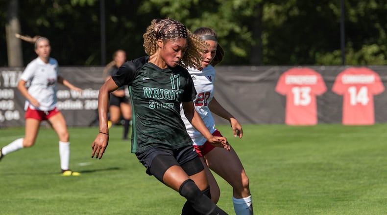 Wright State's Olga Massombo shields the ball from Miami's Mercedes Schroer during a match earlier this season. Joseph Craven/Wright State Athletics