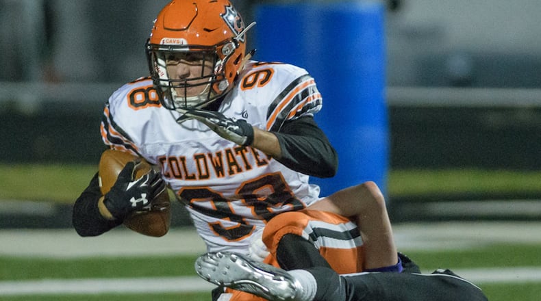 Coldwater tight end Zach Klosterman catches a touchdown pass in the second quarter of a Division V regional final on Saturday night at Good Samaritan Stadium in Clayton. BRYANT BILLING/CONTRIBUTED